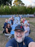 Club members and partners enjoying a BBQ together